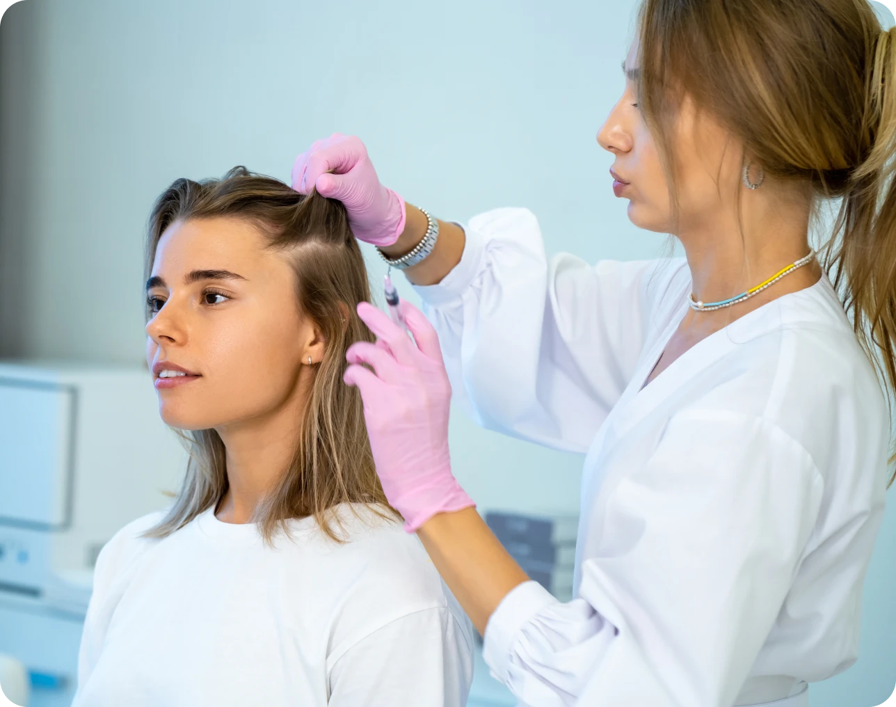 Hair treatment procedure in a clinic setting.